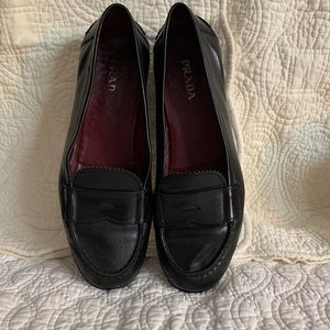 Vintage size 9 woman’s black leather Prada loafers.